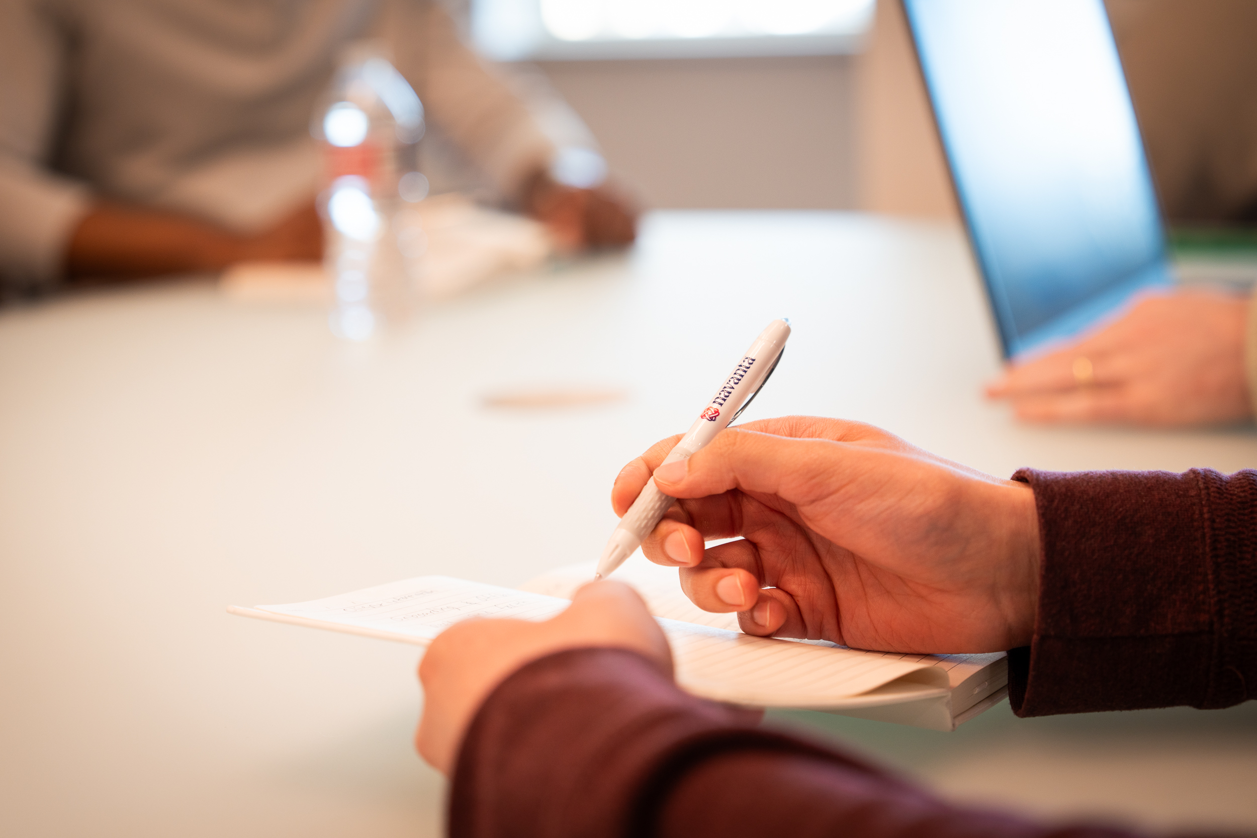 Close up of hand writing with a pen.